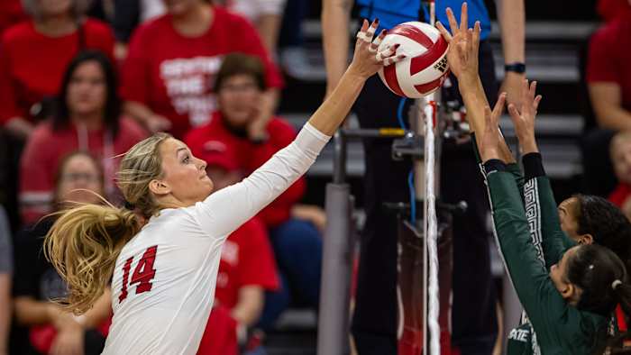 Nebraska outside hitter Ally Batenhorst jousts at the net against Michigan State (Oct. 13, 2023)